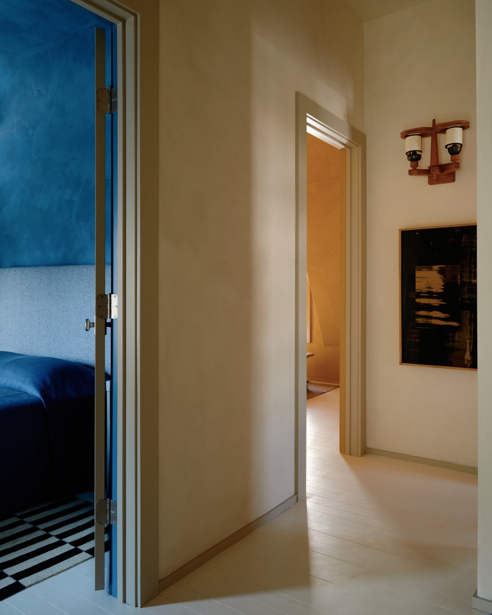 Light-filled bungalow bedroom featuring curated furnishings, soft neutral palette, and refined quiet