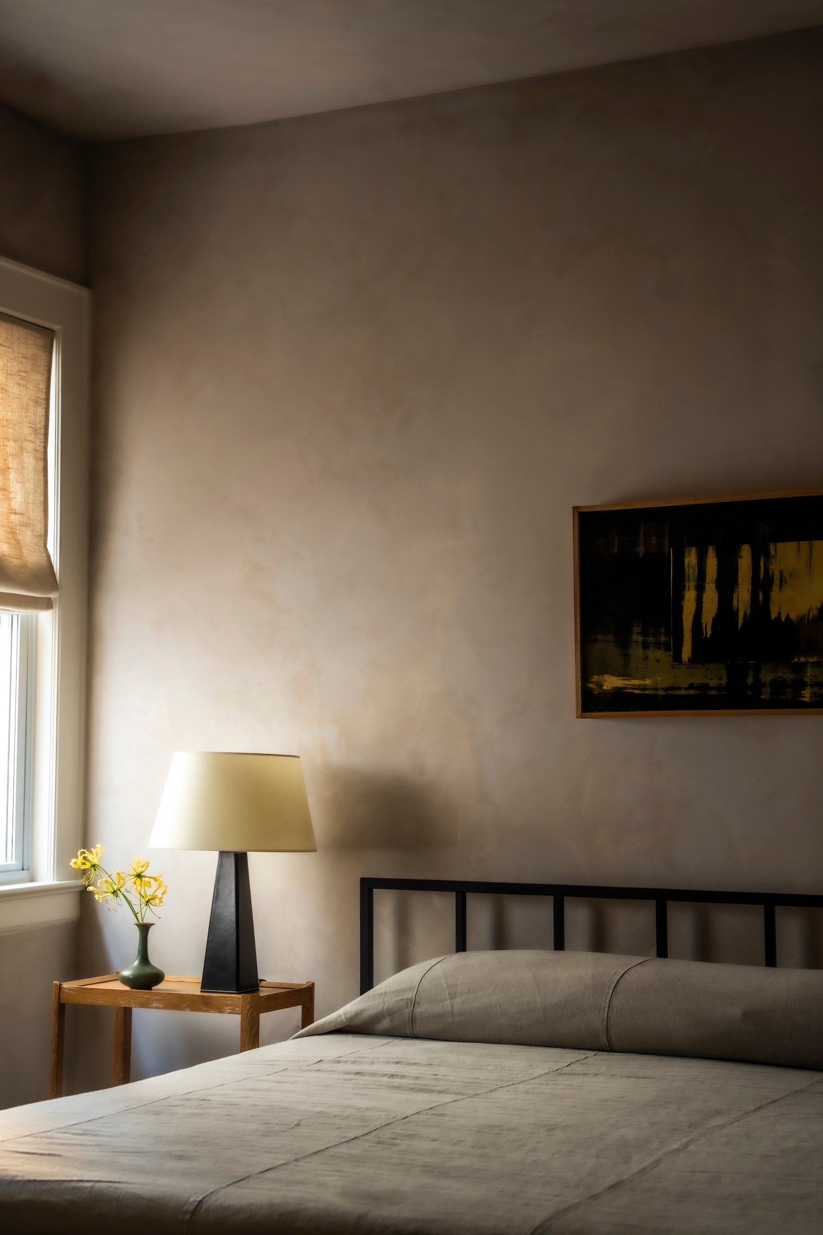 King bed with European linens at Bradley Beach boutique hotel.