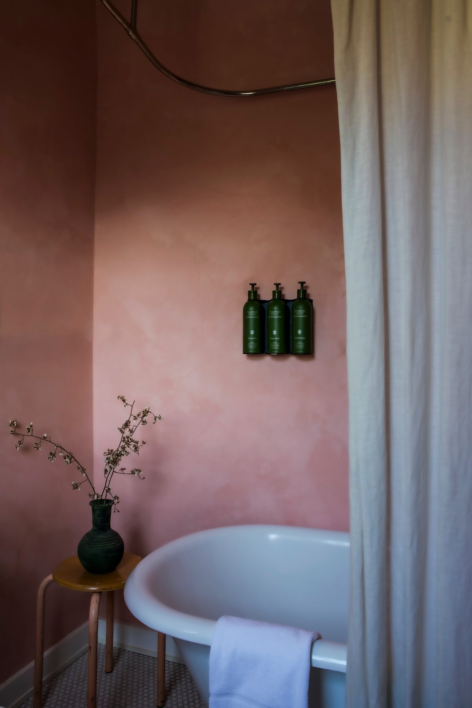 Queen Room detail shot with soft coastal light and handcrafted decor.