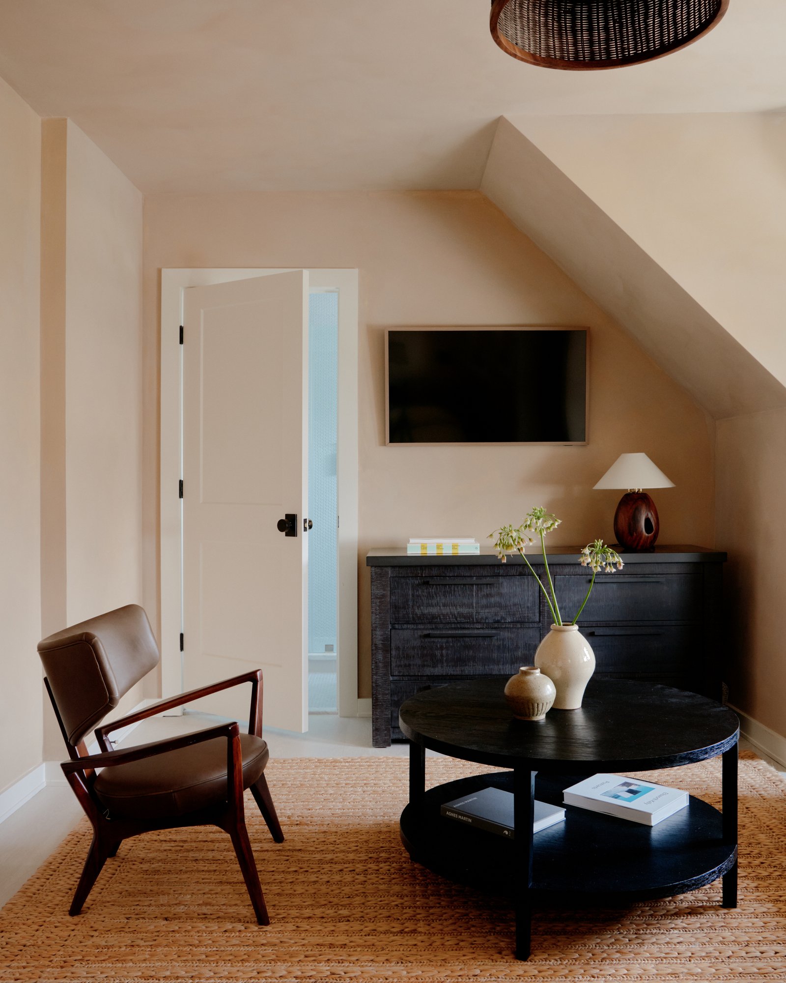 Queen Studio sitting area with sculptural objects and natural light.