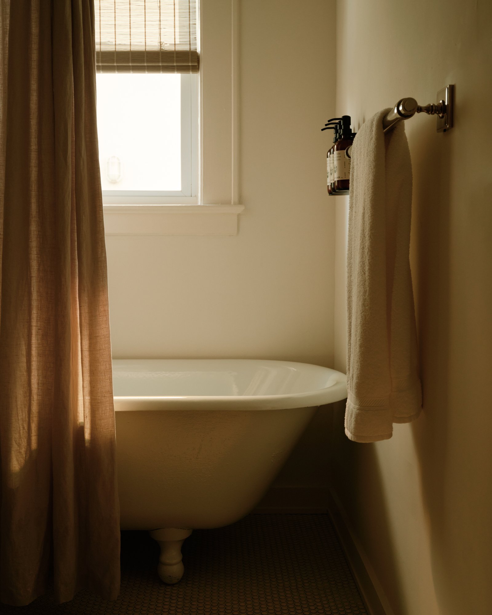 King Room window light and plastered walls at The James Bradley Clawfoot Tub
