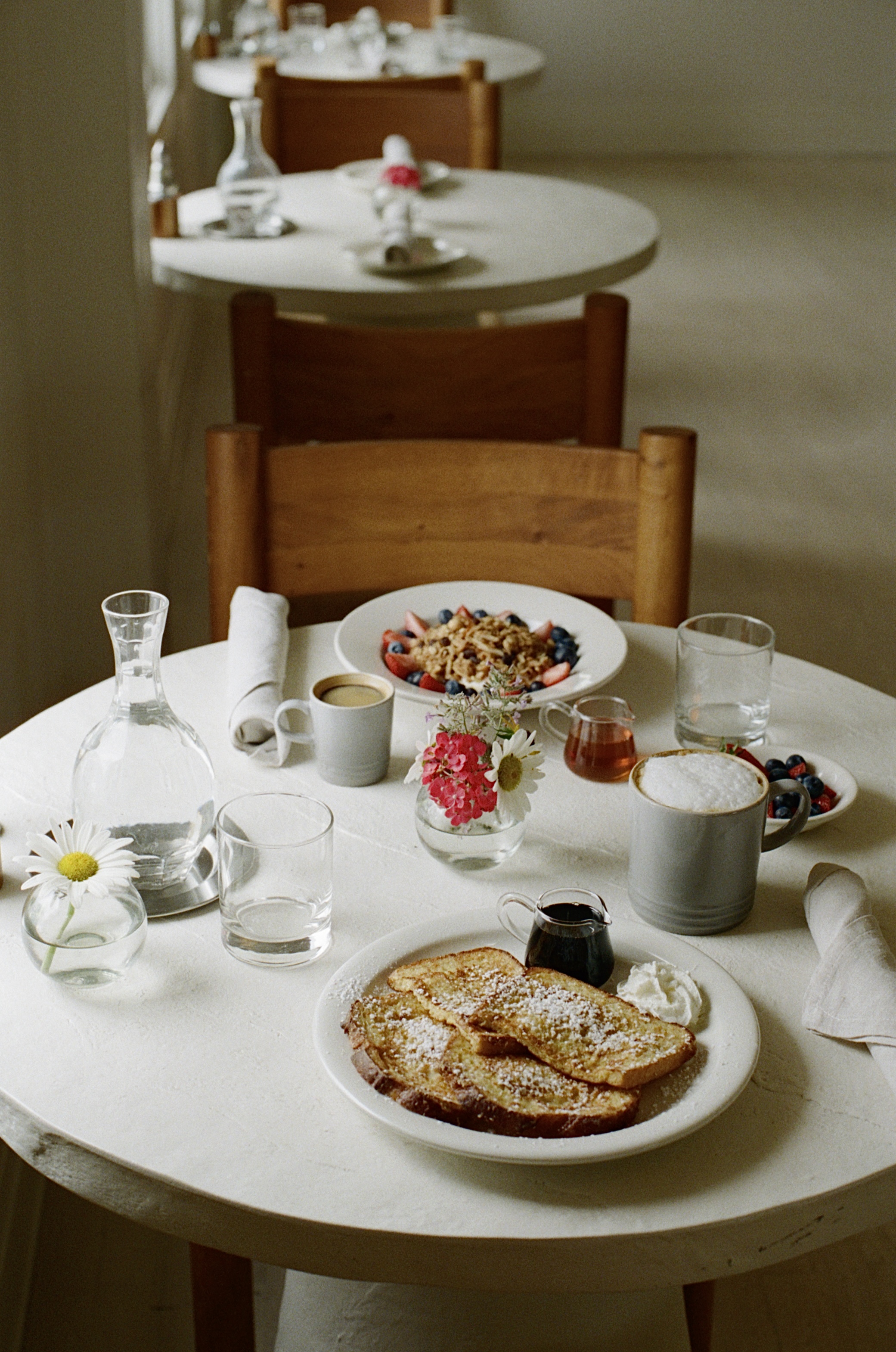 Breakfast spread at boutique hotel in Bradley Beach with pastries, fruit, and fresh juices.
